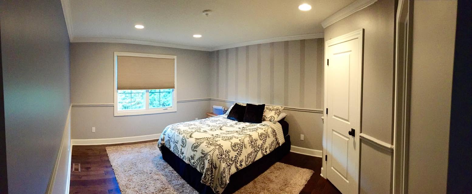 Finished bedroom with painted walls, trim, ceiling, and detailed molding
