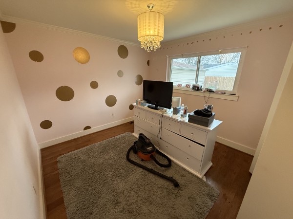 Bedroom before repainting with pale walls and circular wall decals