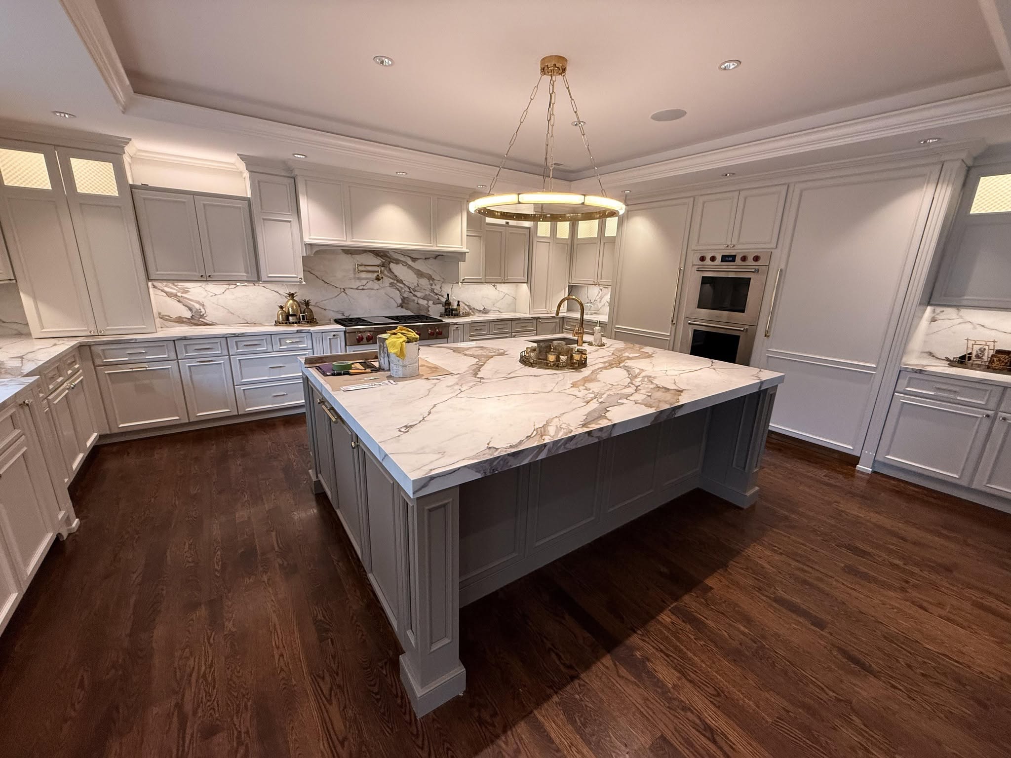Finished gray kitchen cabinets with detailed trim in a Metro Detroit home